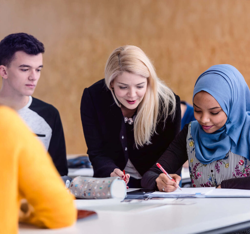 students huddled around