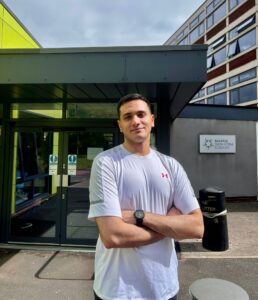 Mohammad Matin in front of the college